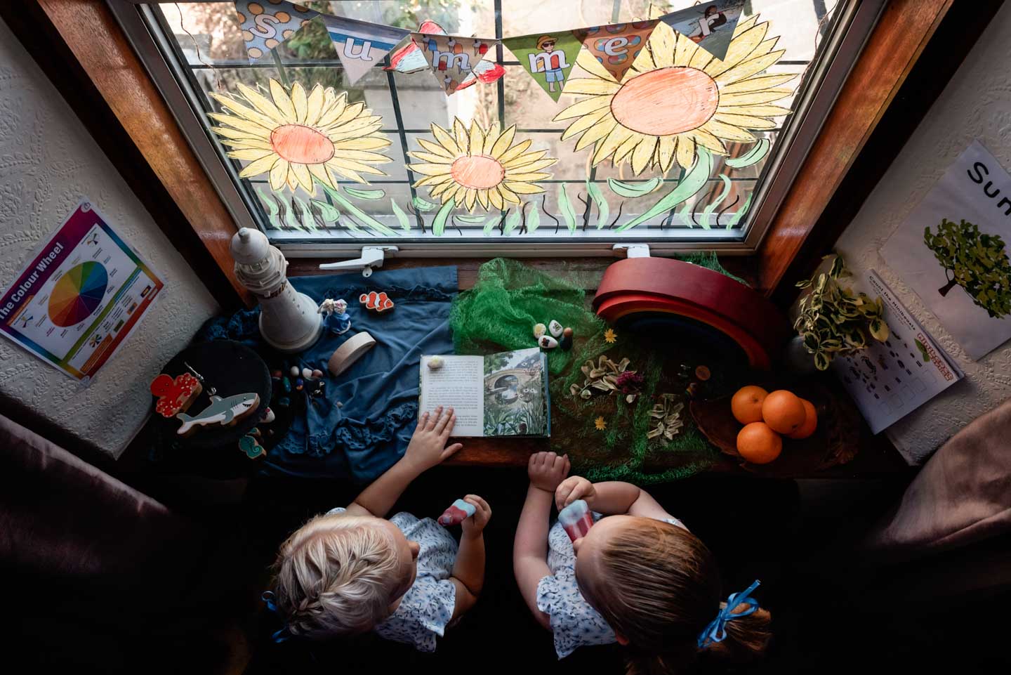 CJPOTY July 2023 shortlisted image for the Summer theme - sunflower window painting and children